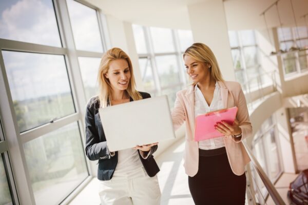 Professional businesswomen collaborating in an office environment