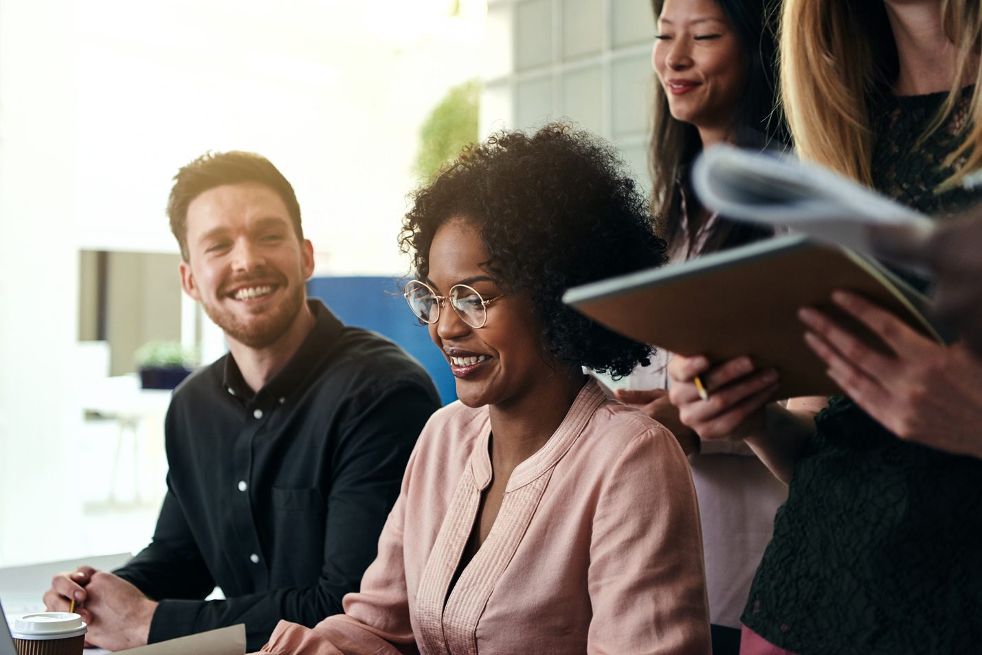 Team of business professionals collaborating during an accounting and financial planning meeting