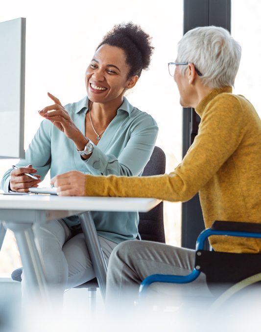 Business mentorship and team collaboration in a diverse modern office environment
