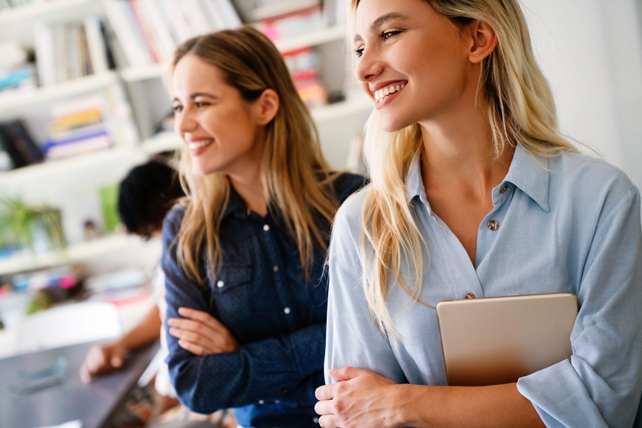 Confident business professional standing in a modern workspace representing successful business growth
