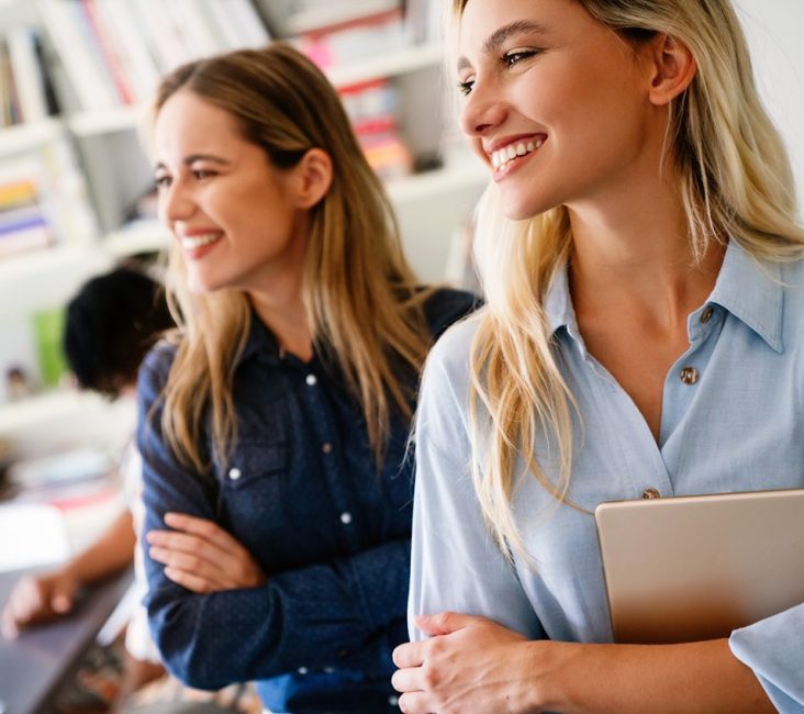 Confident business professional standing in a modern workspace representing successful business growth